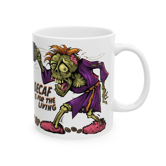 A white ceramic mug with a cartoon illustration of a zombie character holding a coffee cup, with the text 'Decaf is for the Living'.