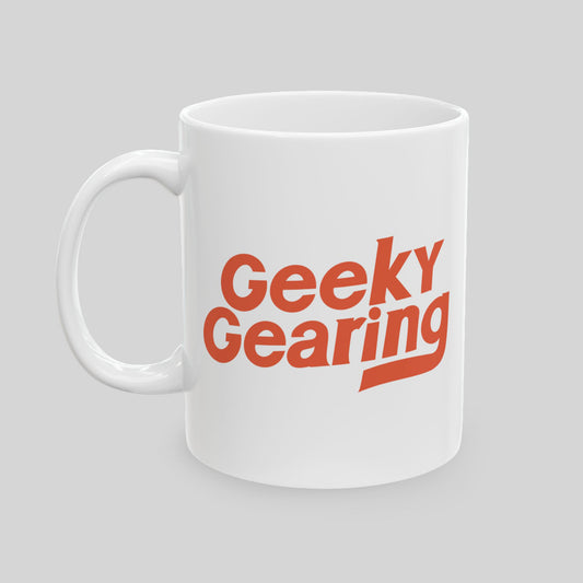 White mug with 'Geeky Gearing' text in red on a light gray background