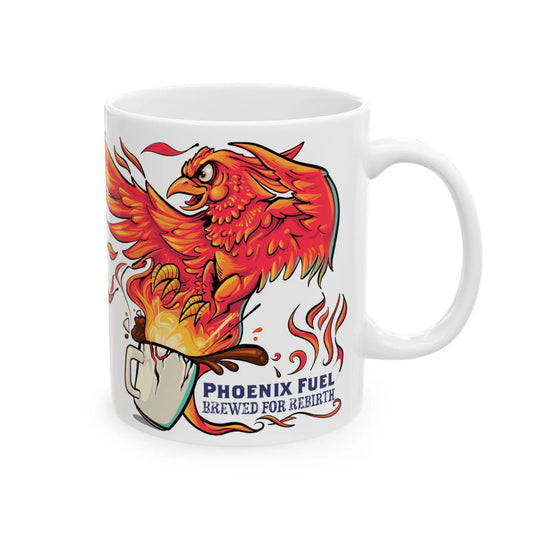 White ceramic mug featuring a bold, cartoon-style red and orange phoenix rising dramatically from a steaming cup of coffee. Flames, steam, and coffee splash upward with the caption "Phoenix Fuel – Brewed for Rebirth" printed beneath the artwork, symbolizing the energizing power of coffee.