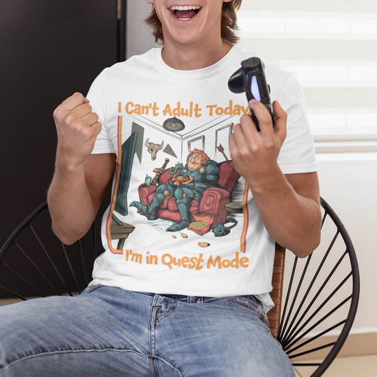 Funny gamer t-shirt: an armored warrior gaming on a sofa, 'I Can't Adult Today', 'I'm in Quest Mode', hand-drawn art, white.
