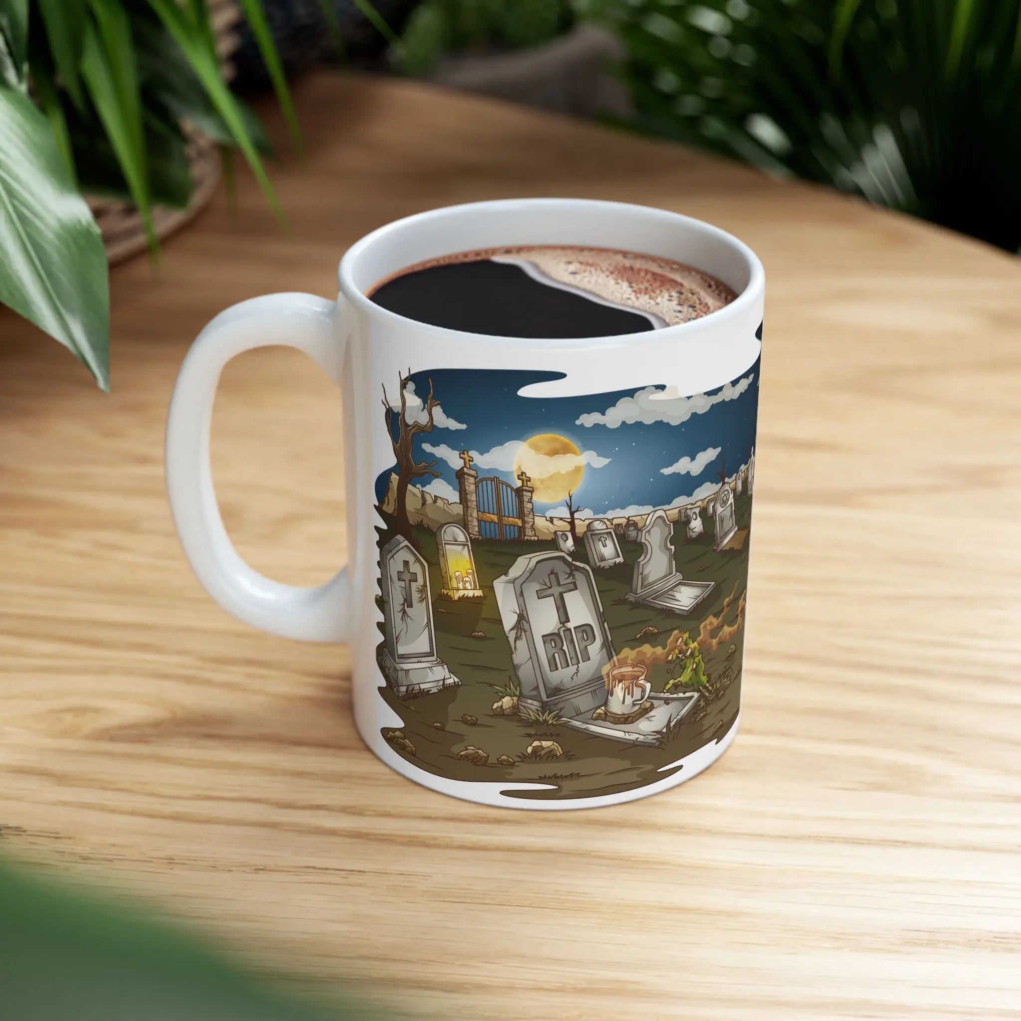 Mug with a graveyard design filled with coffee aroma on a wooden table.