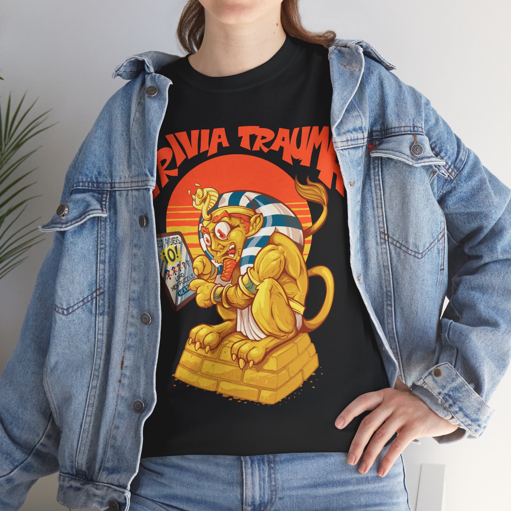 Person wearing a black t-shirt with a colorful graphic design and denim jacket.