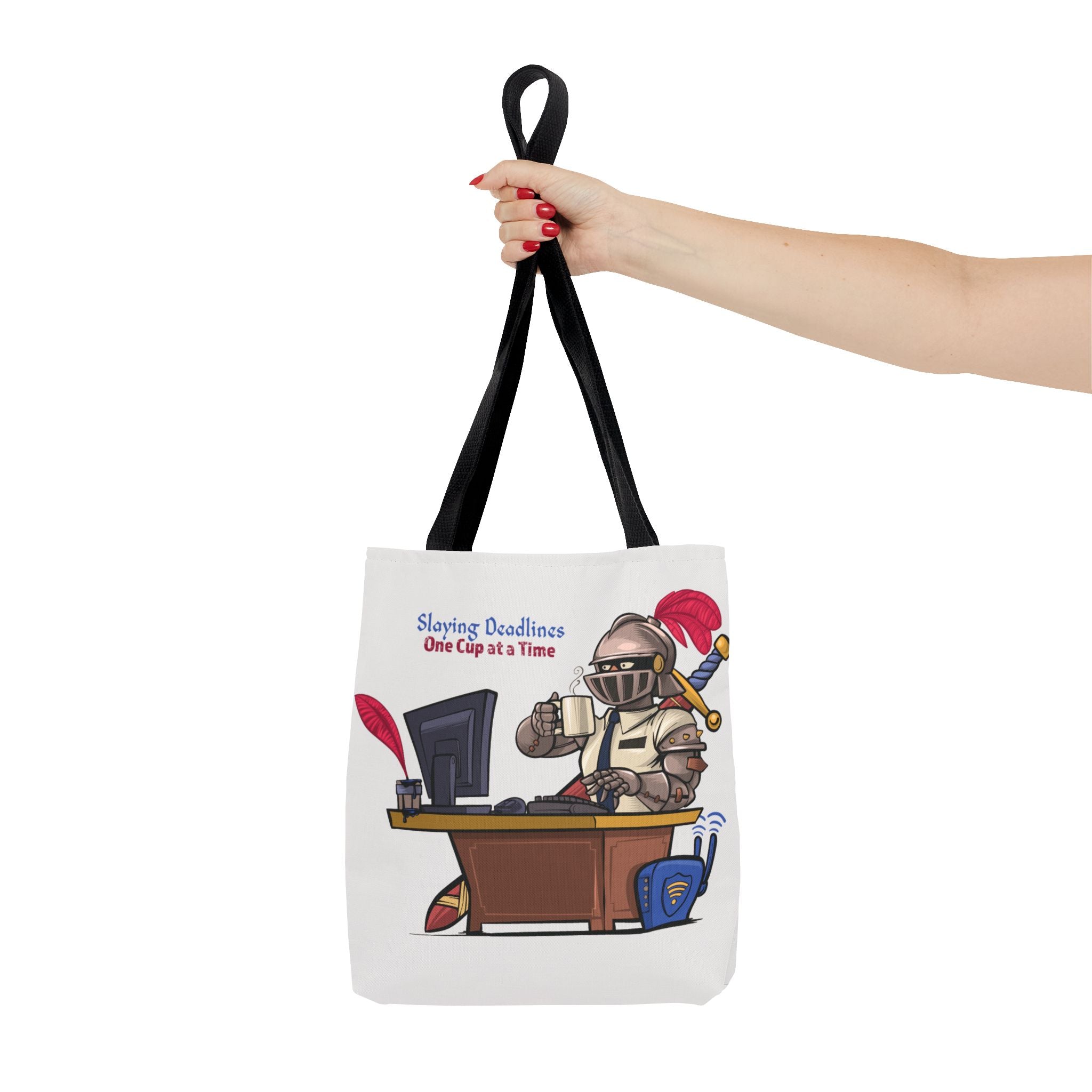 Tote bag with a cartoon character at a desk and text, held by a hand against a white background