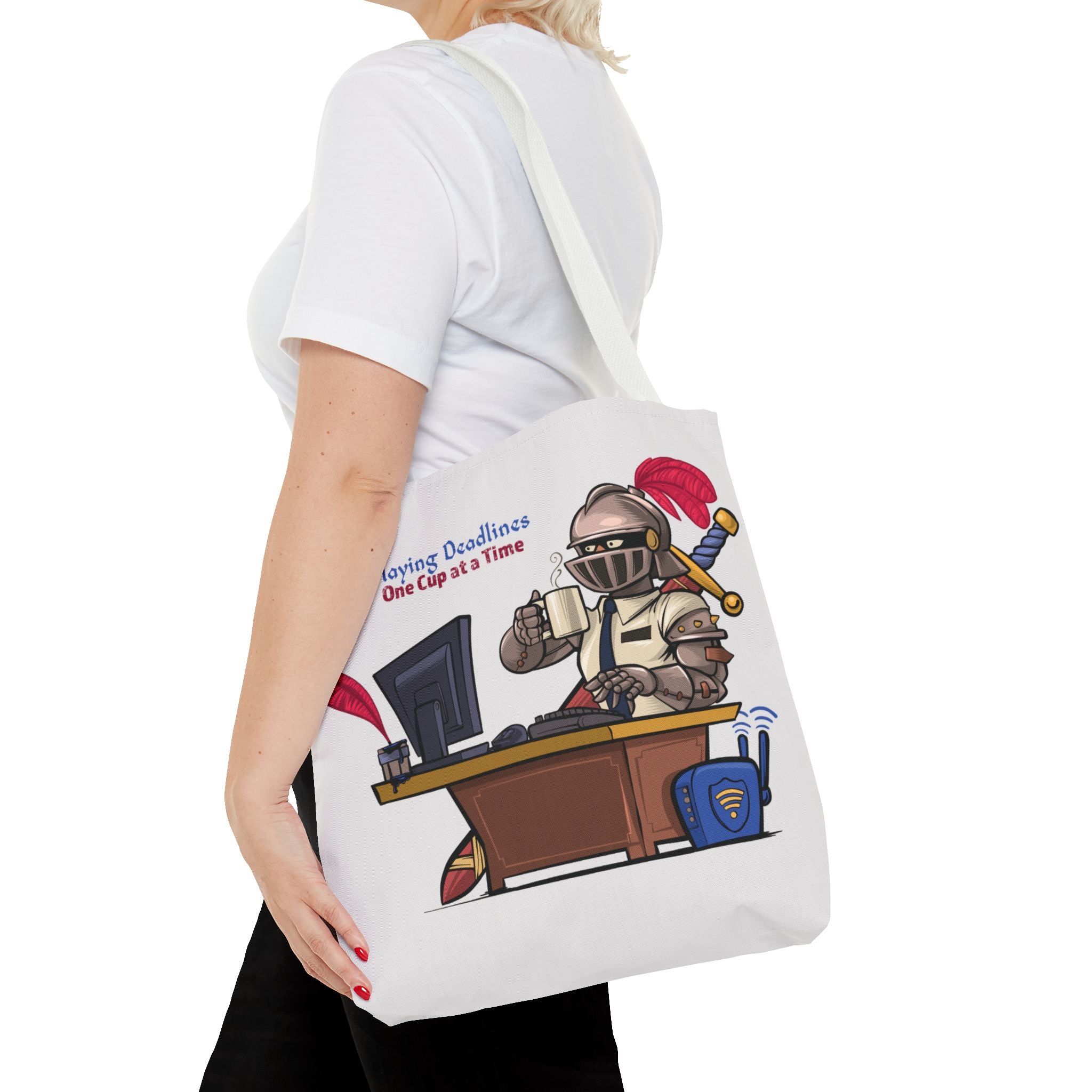 Person holding a tote bag with a cartoon design of a character at a desk with text on a white background