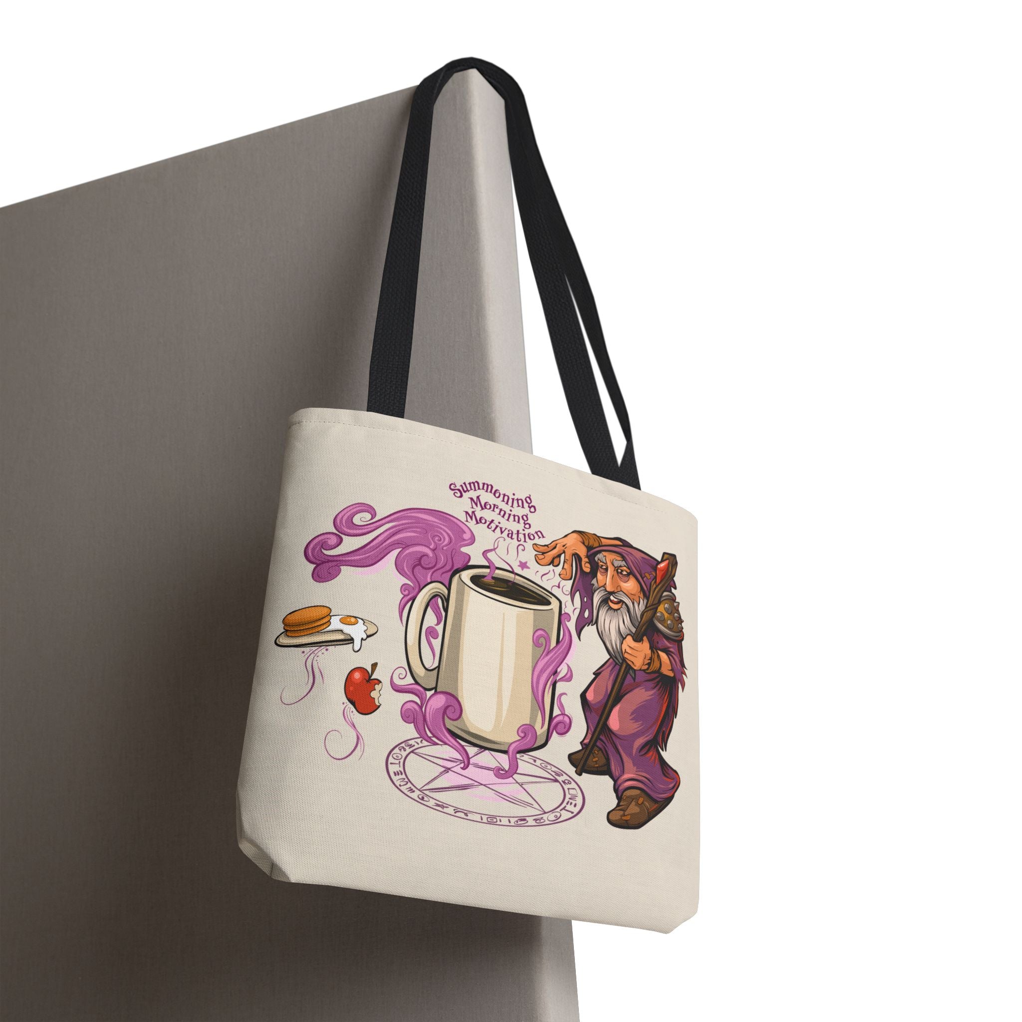Tote bag with a cartoon character and coffee cup design on a cream colored background