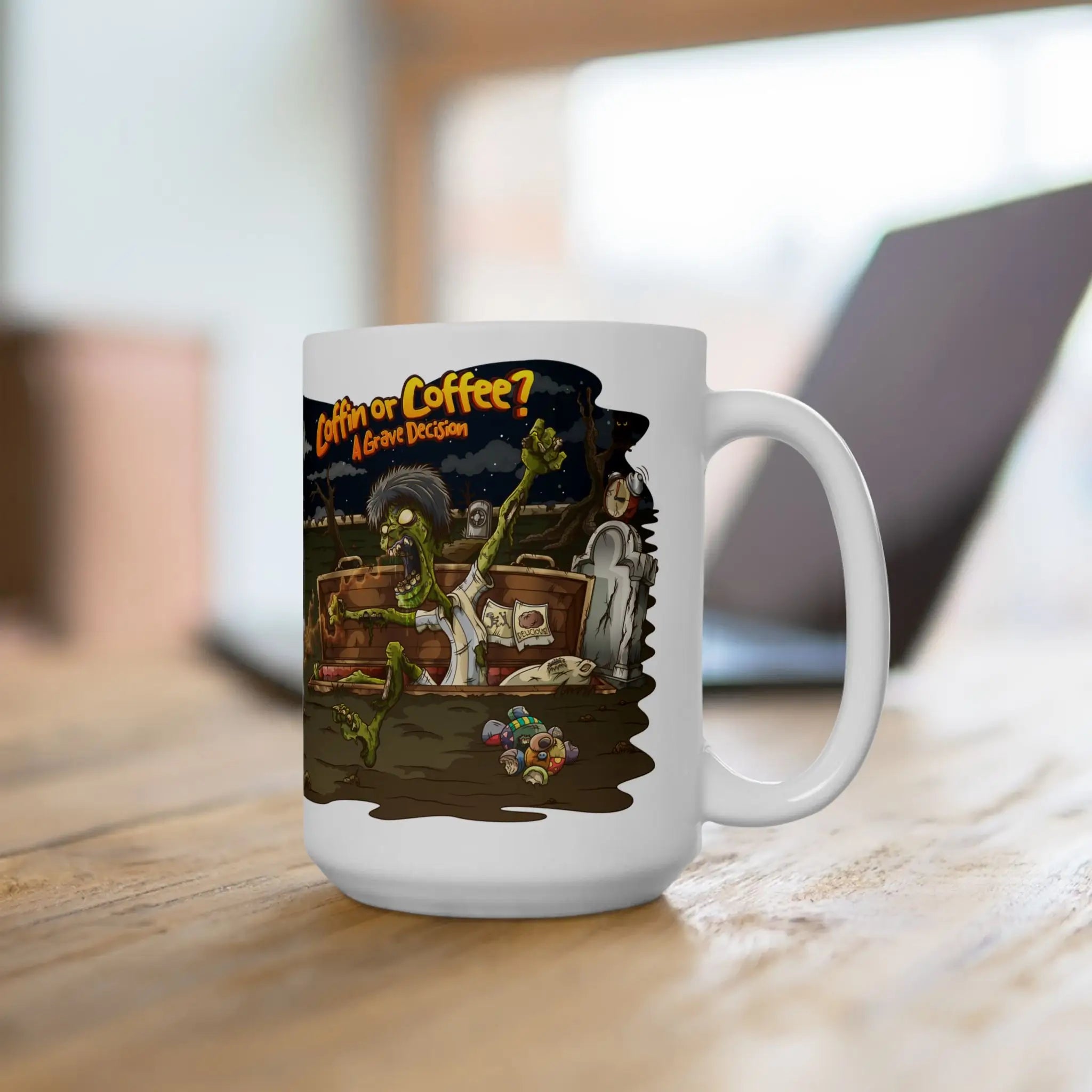White mug with a graphic design of a zombie and text 'Coffee or Coffee? Grave Decision' on a wooden surface.