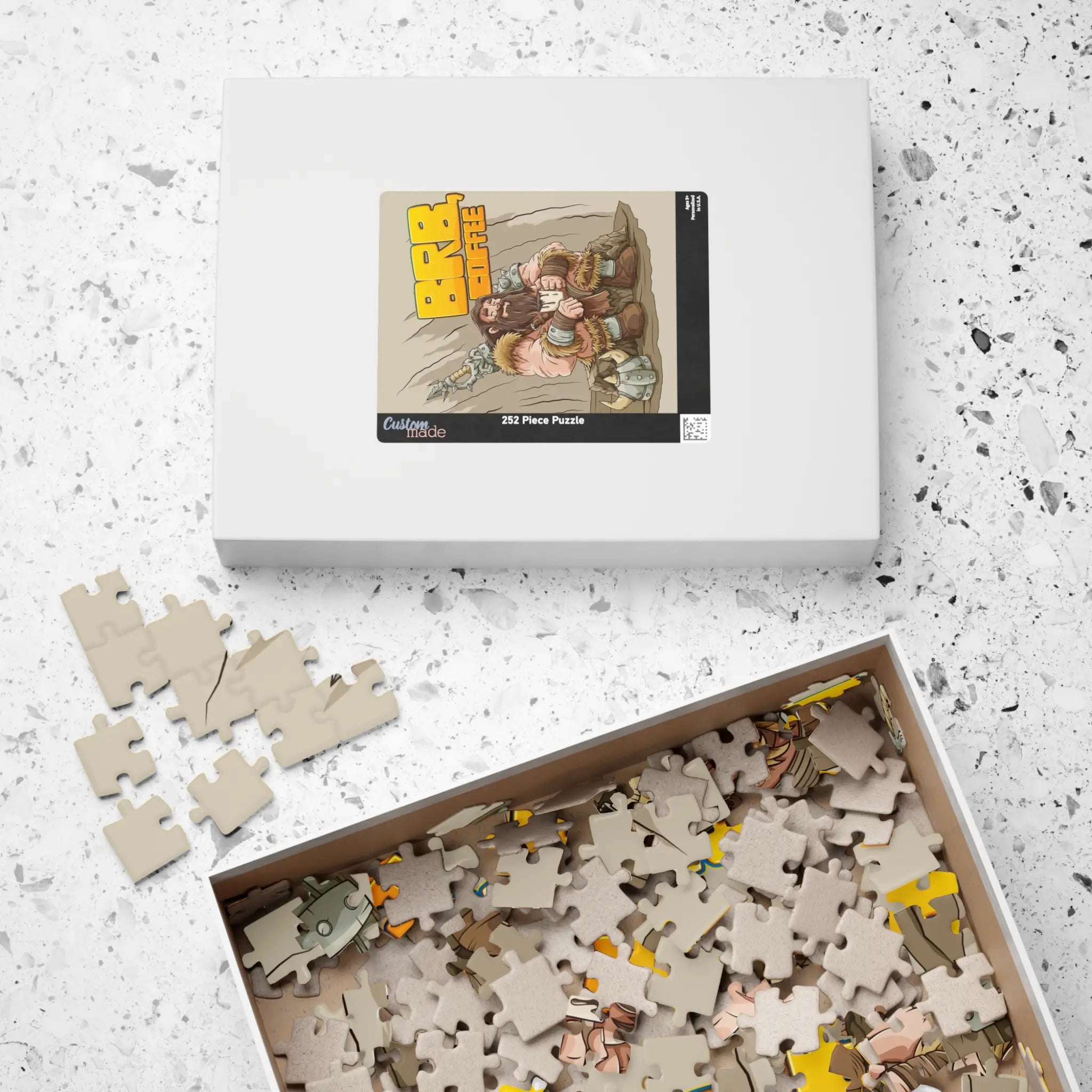 Barbarian’s Coffee Break 252-piece jigsaw set—medium box with reference image on top of lid, pieces spilling out