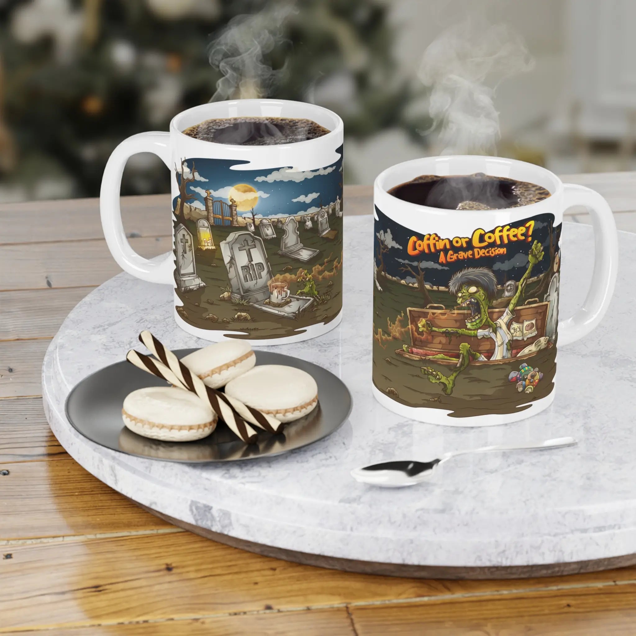Two mugs with Halloween-themed designs on a marble tray with cookies and a spoon.