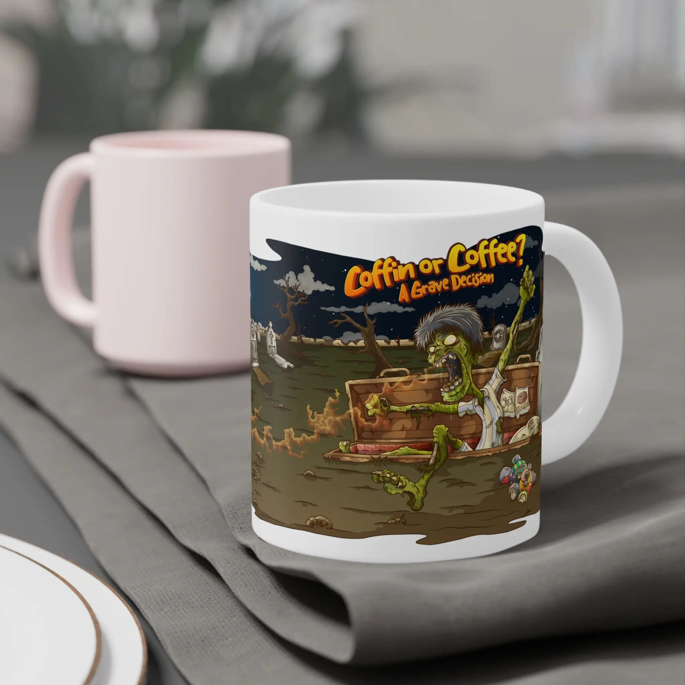 Ceramic mug with a funny Halloween design of a zombie rising from the grave thanks to the smell of coffee