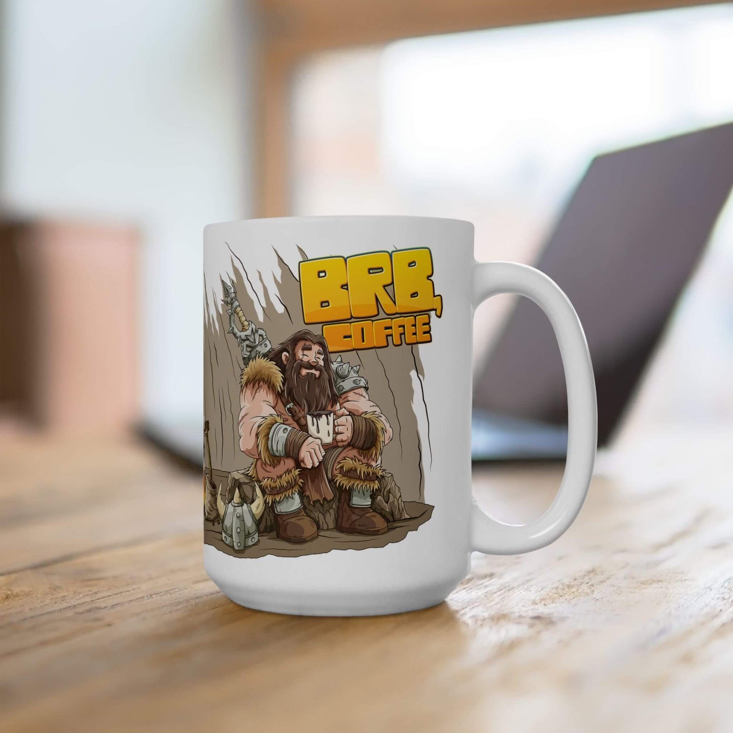 White mug with a cartoon barbarian and 'BRB Coffee' text on a wooden surface.