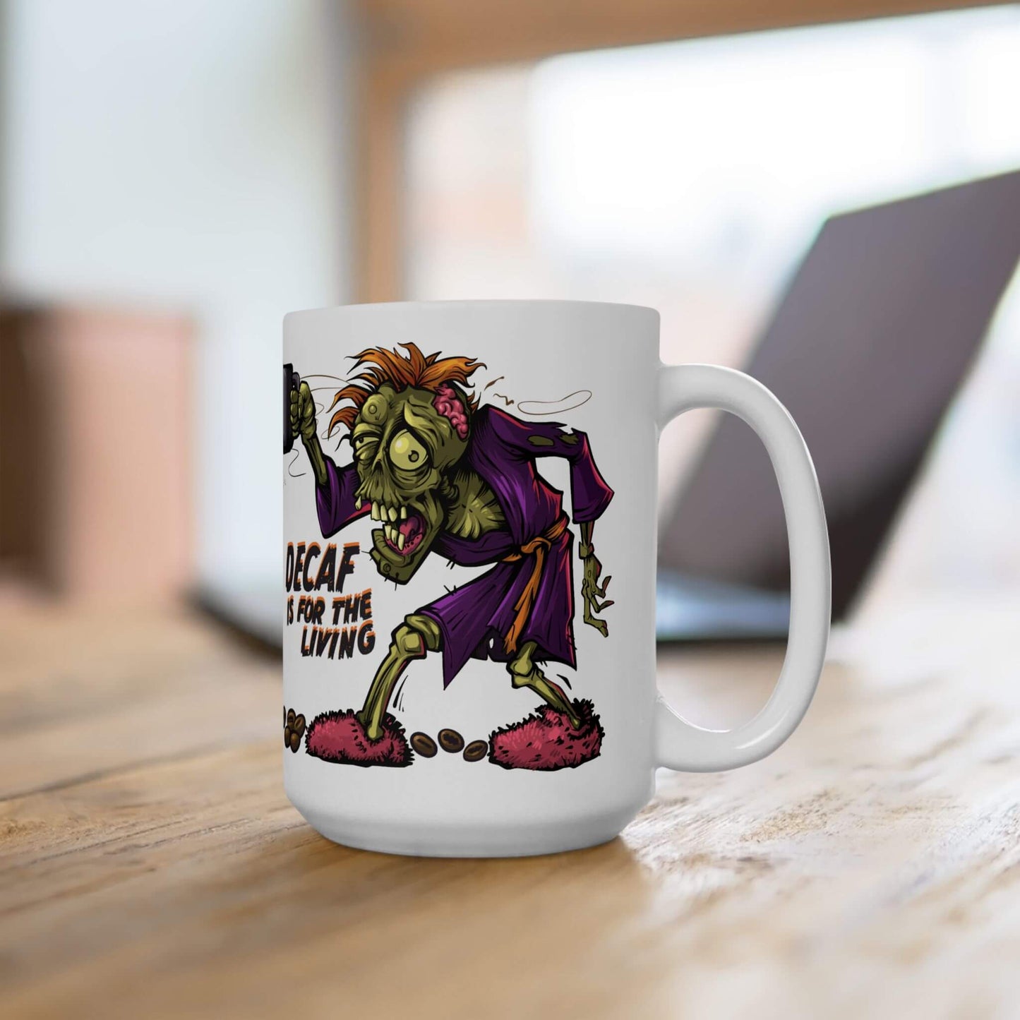 White mug with a cartoon zombie design and text on a wooden surface.