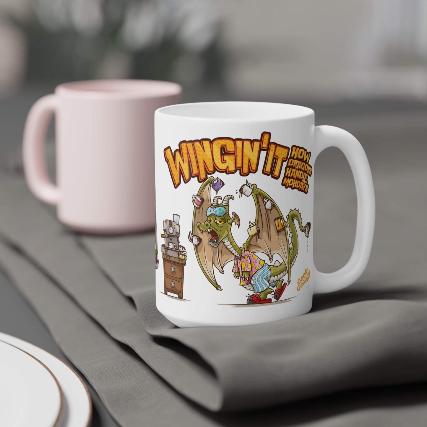 White mug with cartoon dragon design and text on a gray surface