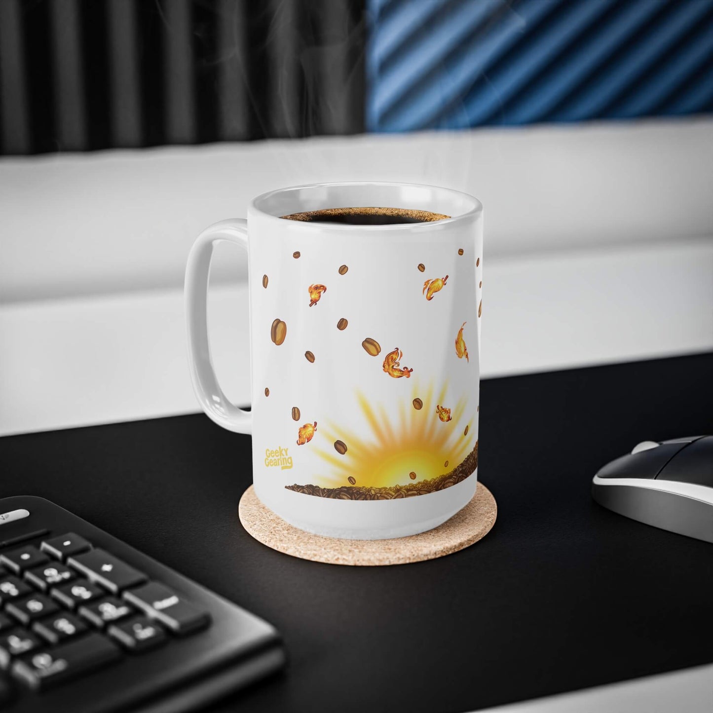 White mug with coffee and sunrise design on a desk with keyboard and mouse