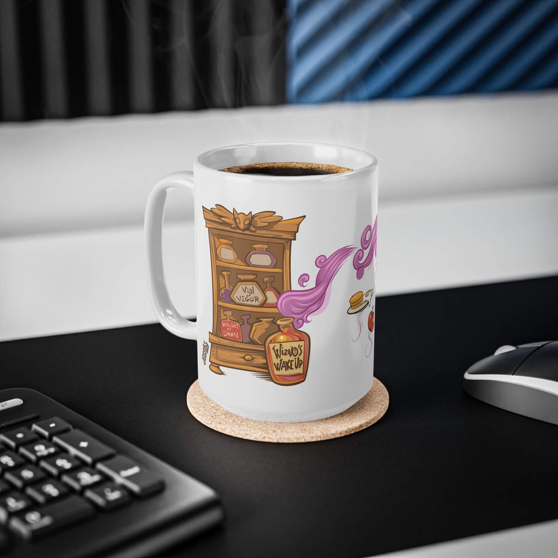 White mug with a colorful design on a desk with a keyboard and mouse.