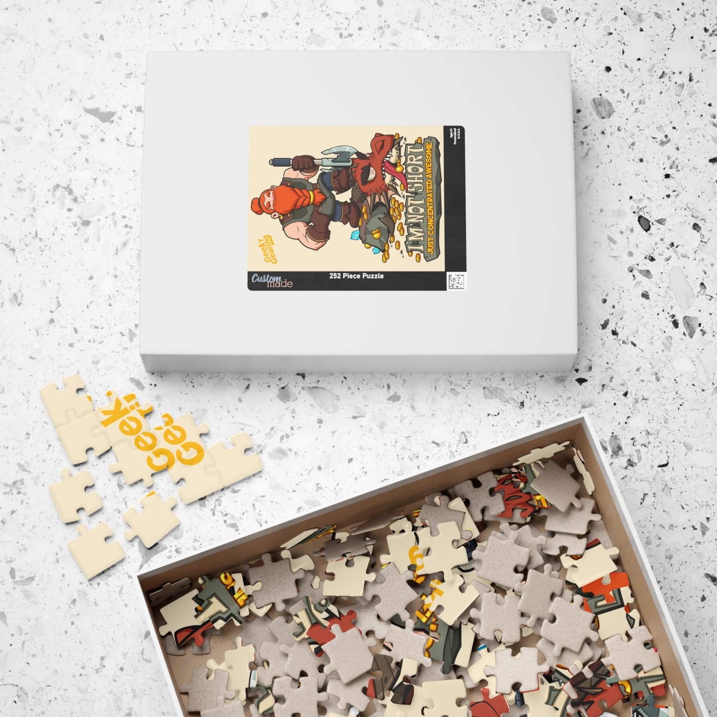 Puzzle set with pieces scattered on a white surface