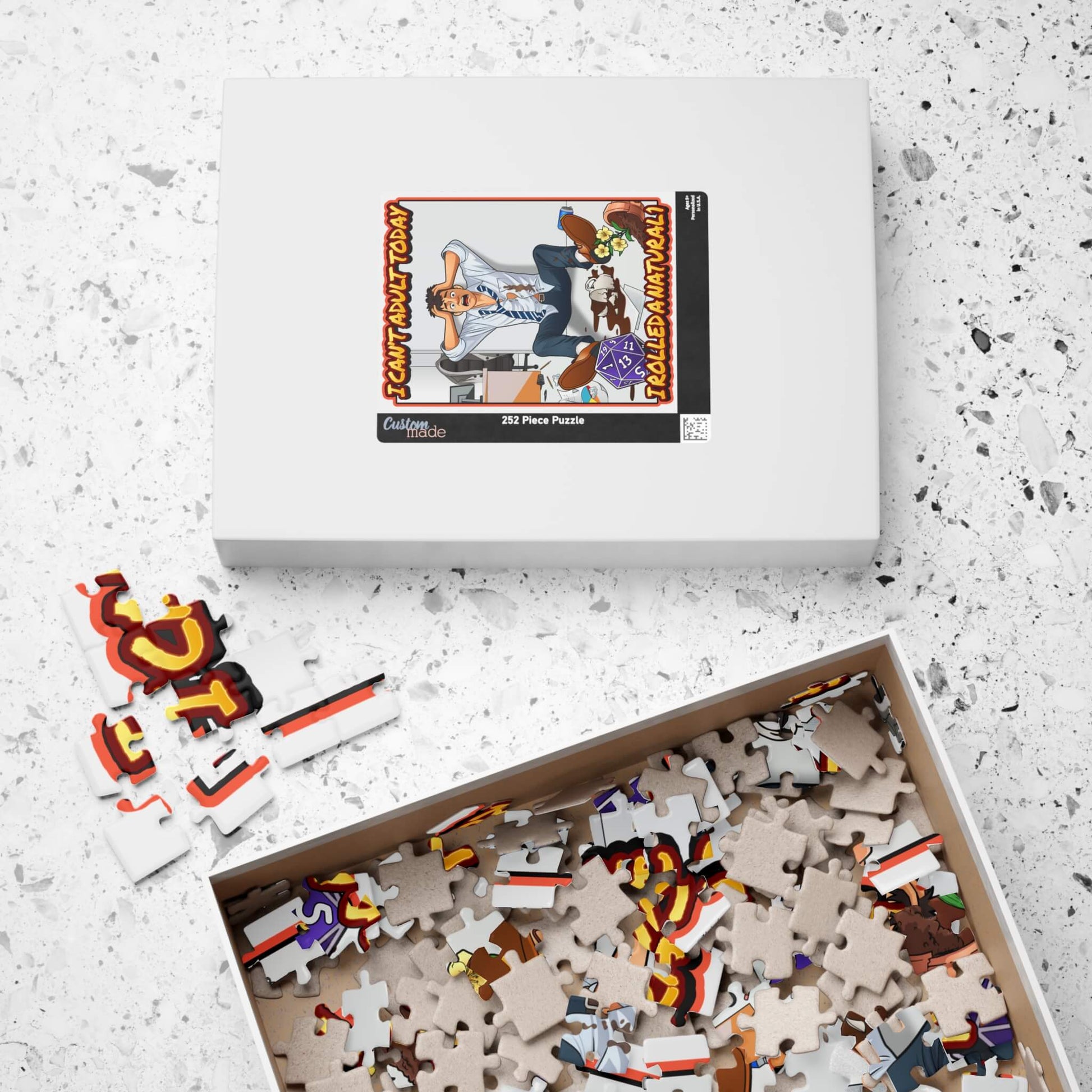 Puzzle set with pieces and packaging on a textured surface