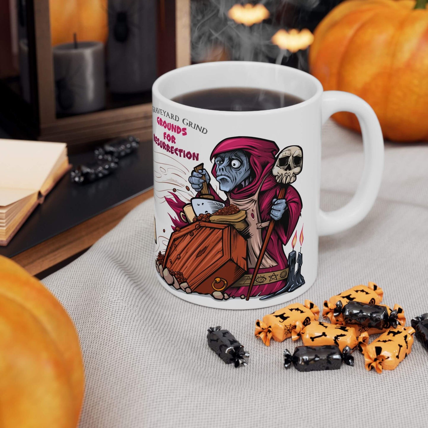 Mug with Halloween-themed design featuring a skeleton necromancer, surrounded by pumpkins and candy on a table.