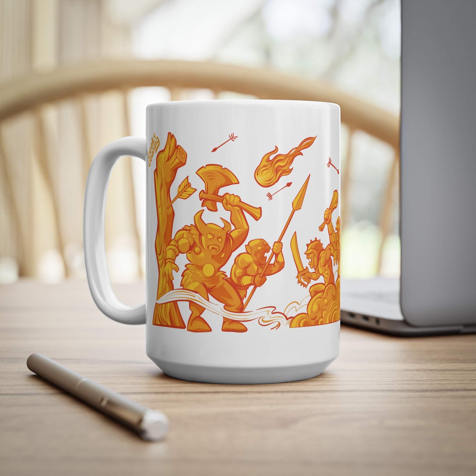 White mug with orange warrior design on a wooden surface