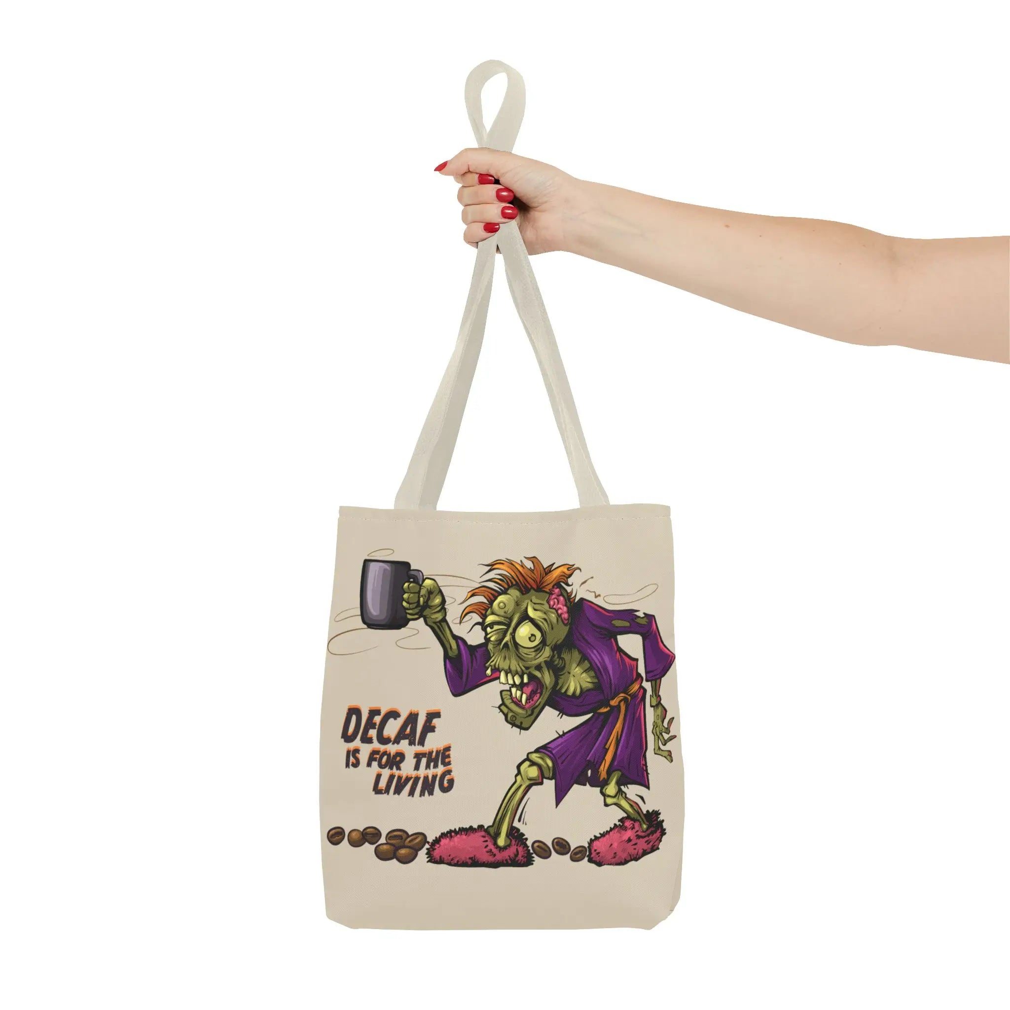 Tote bag with a cartoon character holding a coffee cup and text 'Decaf is for the living' on a white background.
