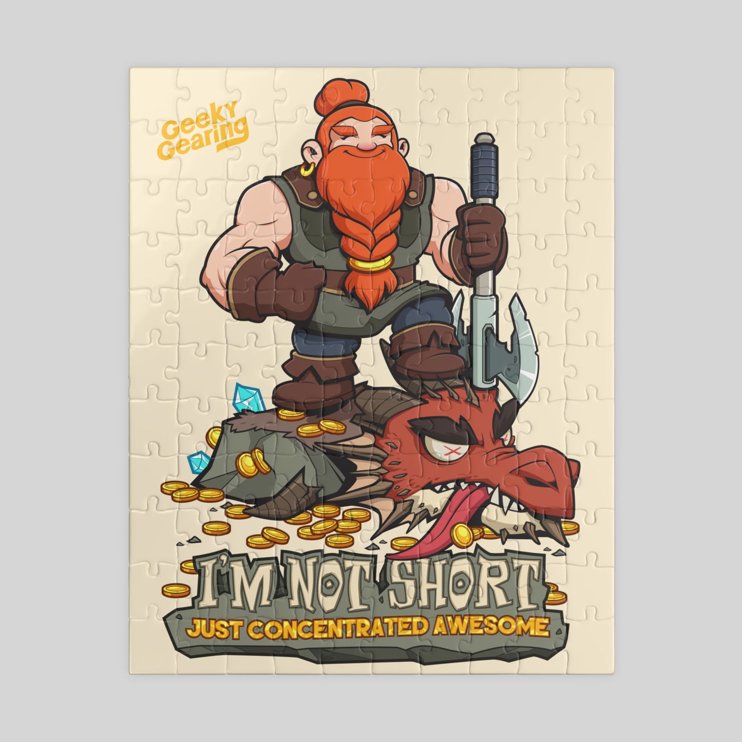 Cartoon dwarf with a beard holding an axe, standing over a defeated dragon, on a puzzle packaging with 'Geeky Gearing' branding, featuring the text 'I'm not short just concentrated awesome'.