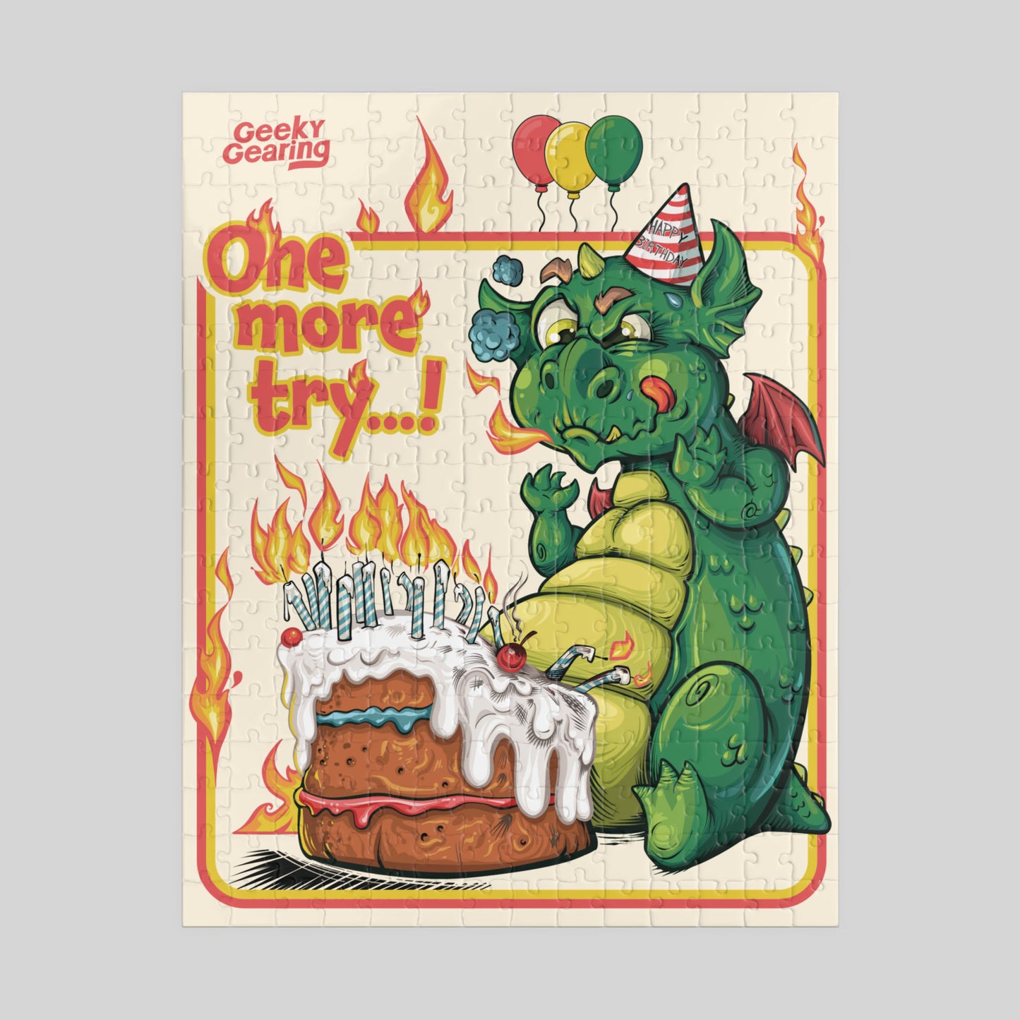Jigsaw puzzle box with a dragon and cake illustration, featuring the brand 'Geeky Gearing'.