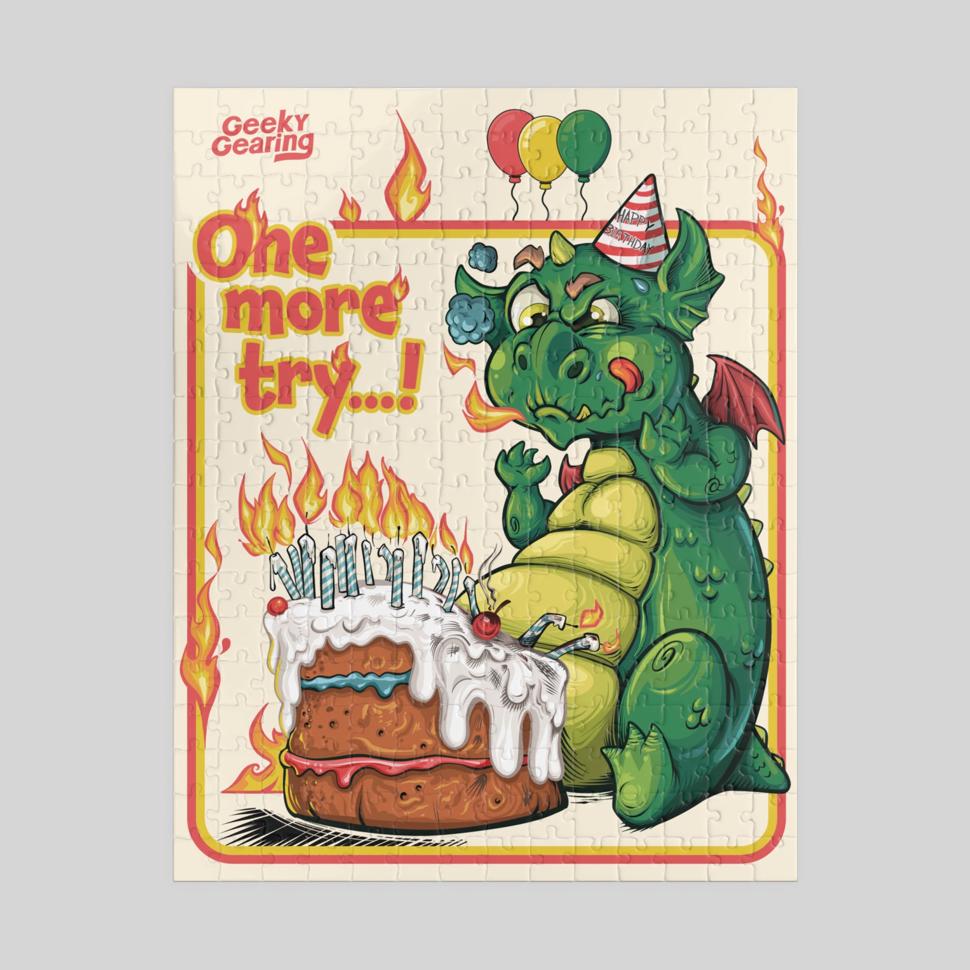 Jigsaw puzzle box with a dragon and cake illustration, featuring the brand 'Geeky Gearing'.