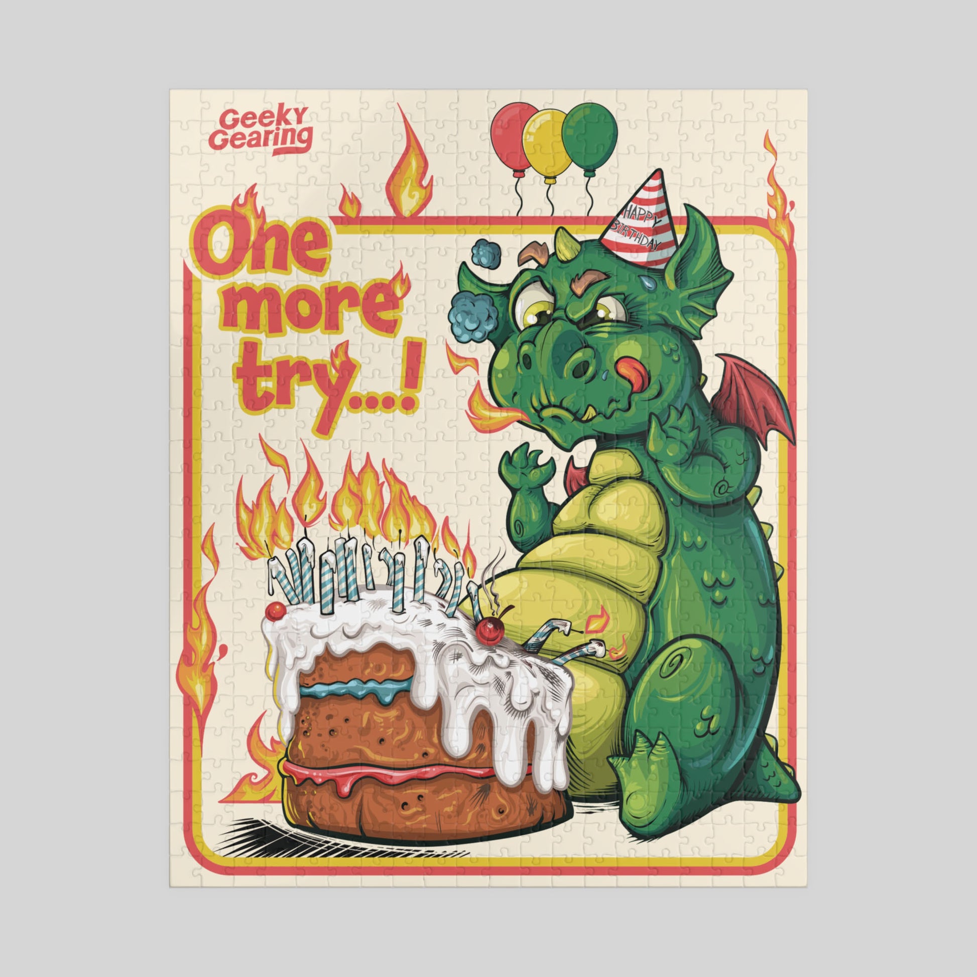 Jigsaw puzzle box with a dragon and cake illustration, featuring the brand 'Geeky Gearing'.