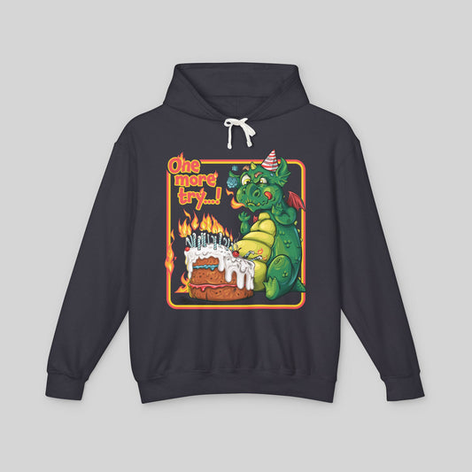 Black hoodie with a dragon graphic and 'One more try!' text on a gray background