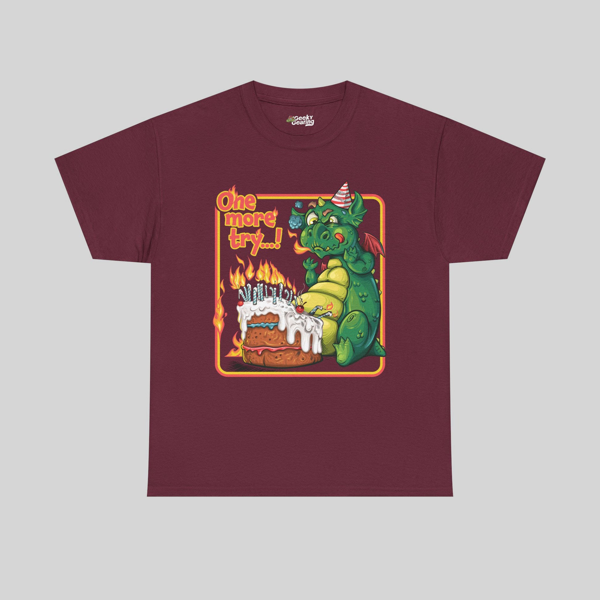 Maroon t-shirt with a dragon graphic and text on a gray background