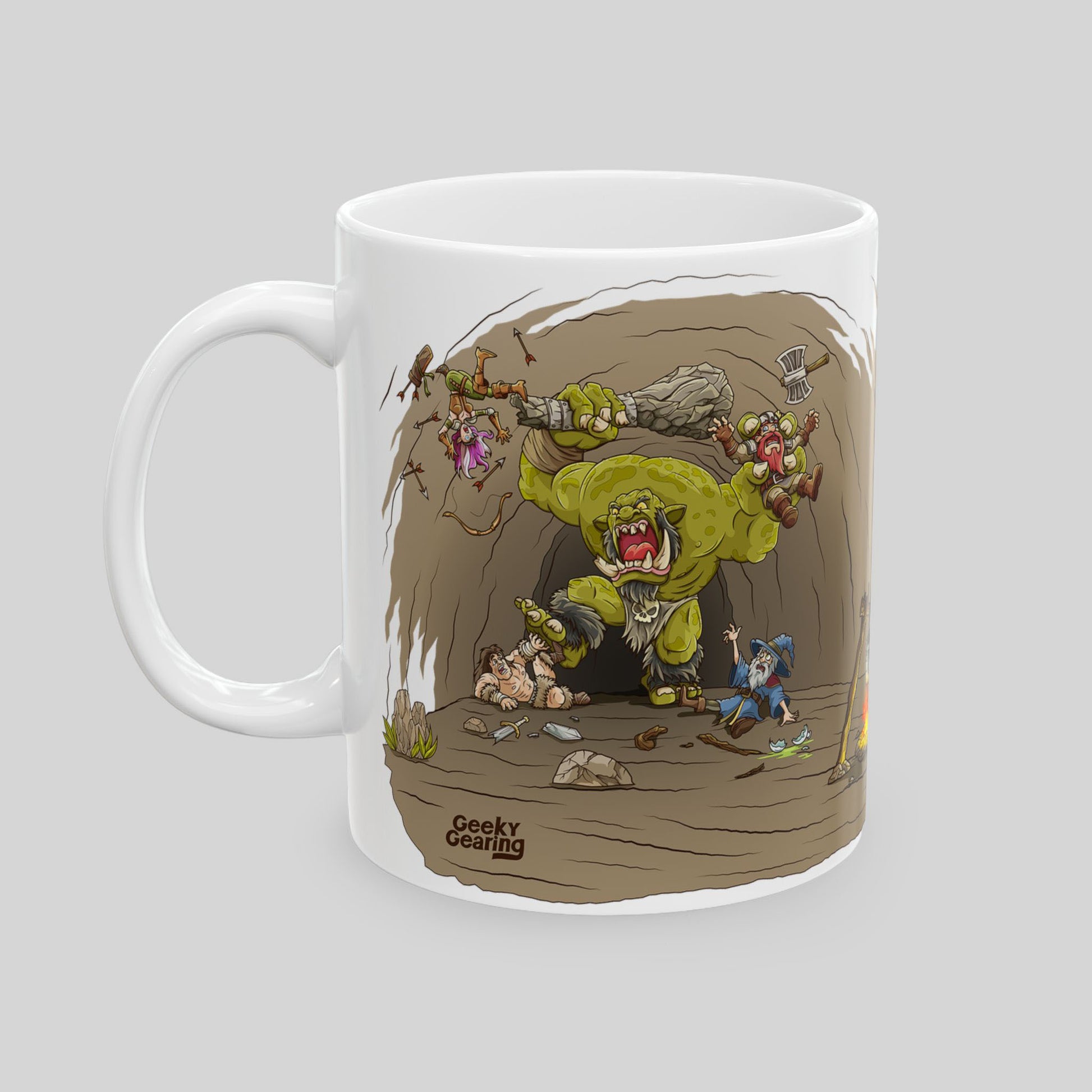 Mug with cartoon design of a monster and characters locked in a fight on a gray background