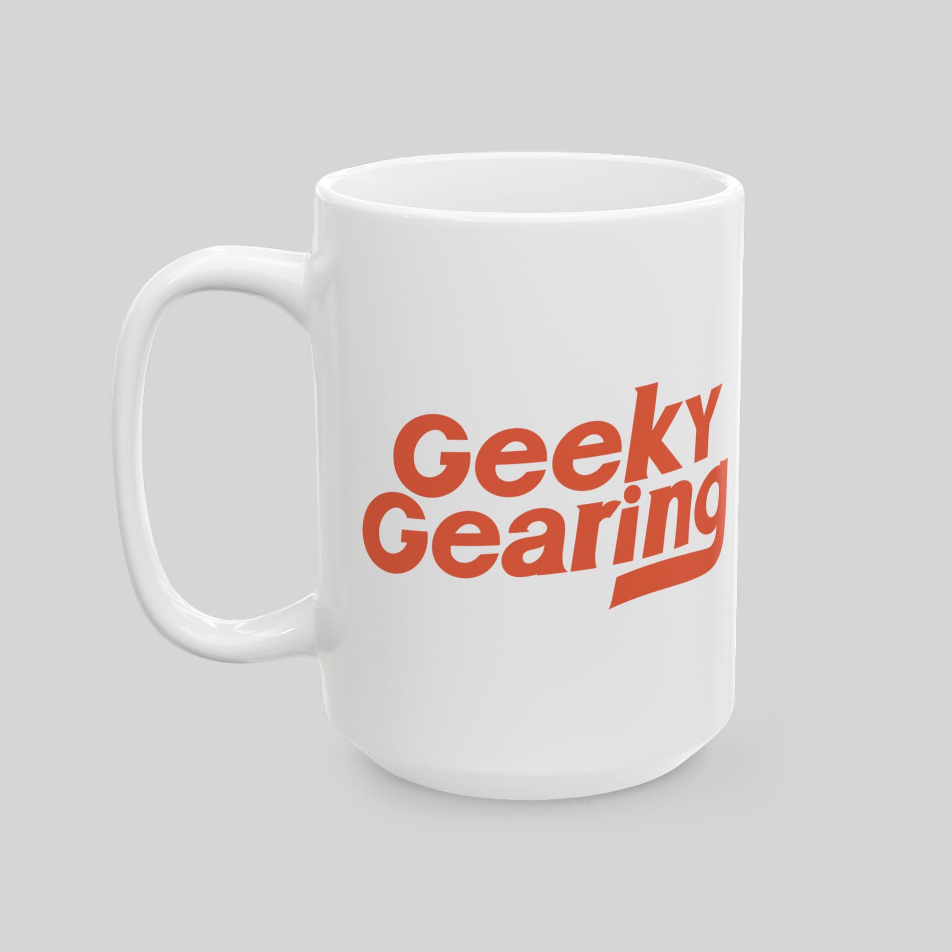 White mug with 'Geeky Gearing' text in red on a gray background