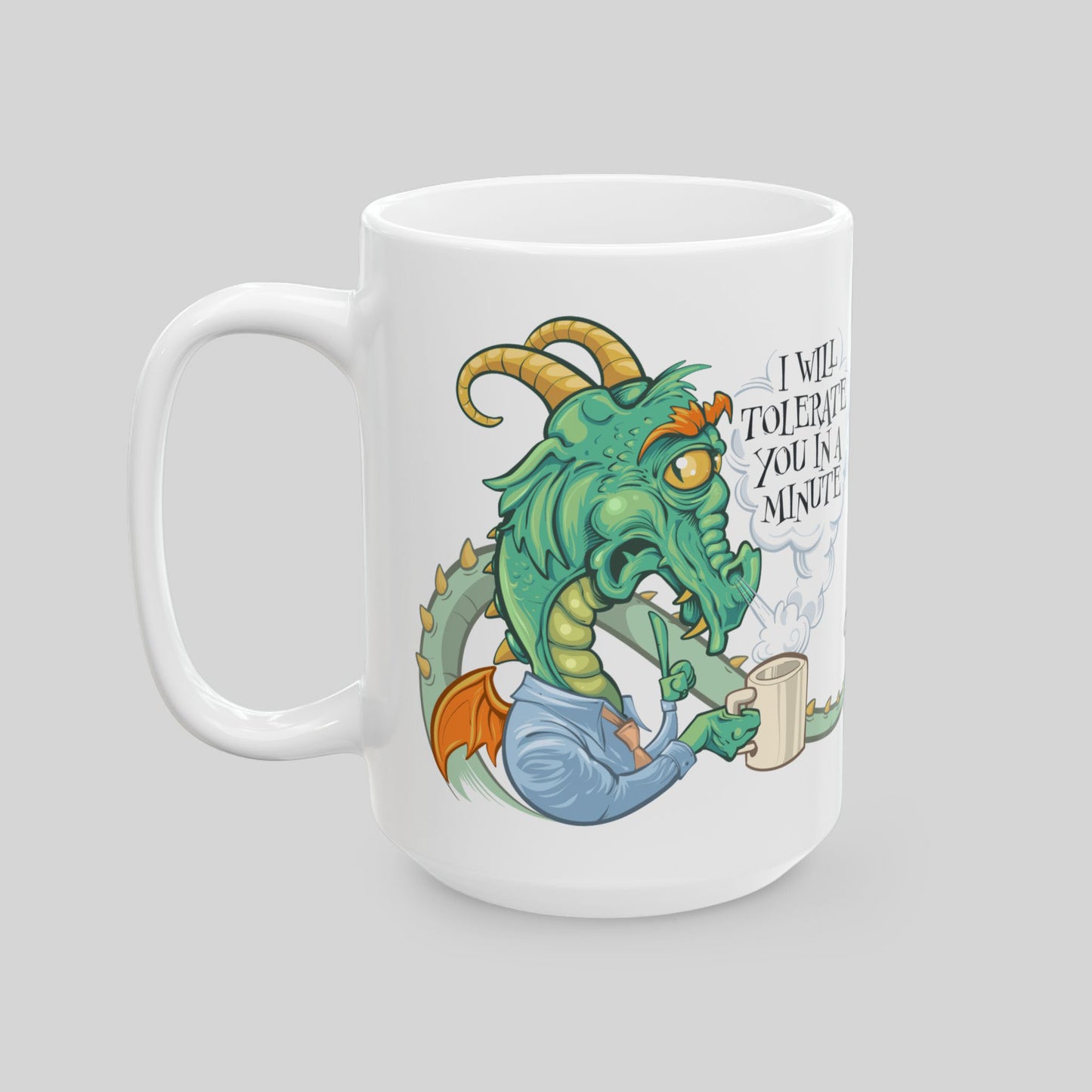 15 oz white ceramic mug with a dragon in office shirt illustration and text on a gray background