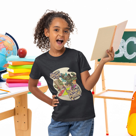 Child wearing a black t-shirt with a colorful graphic design in a classroom setting