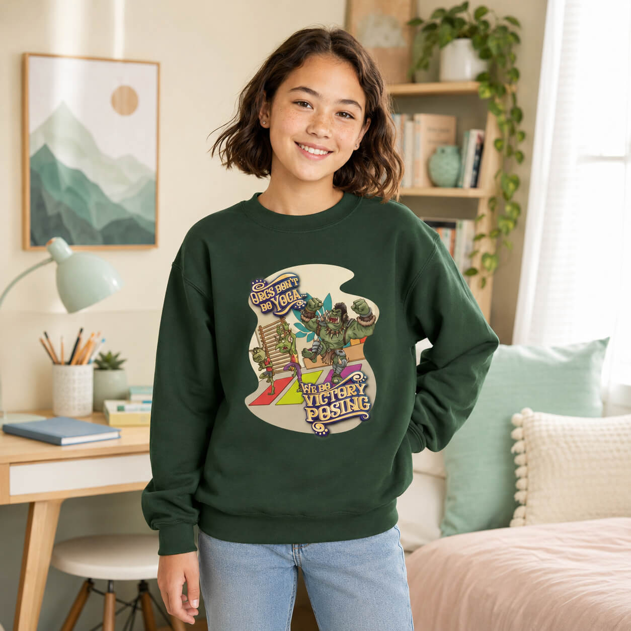 Person wearing a green sweatshirt with a graphic design in a home setting