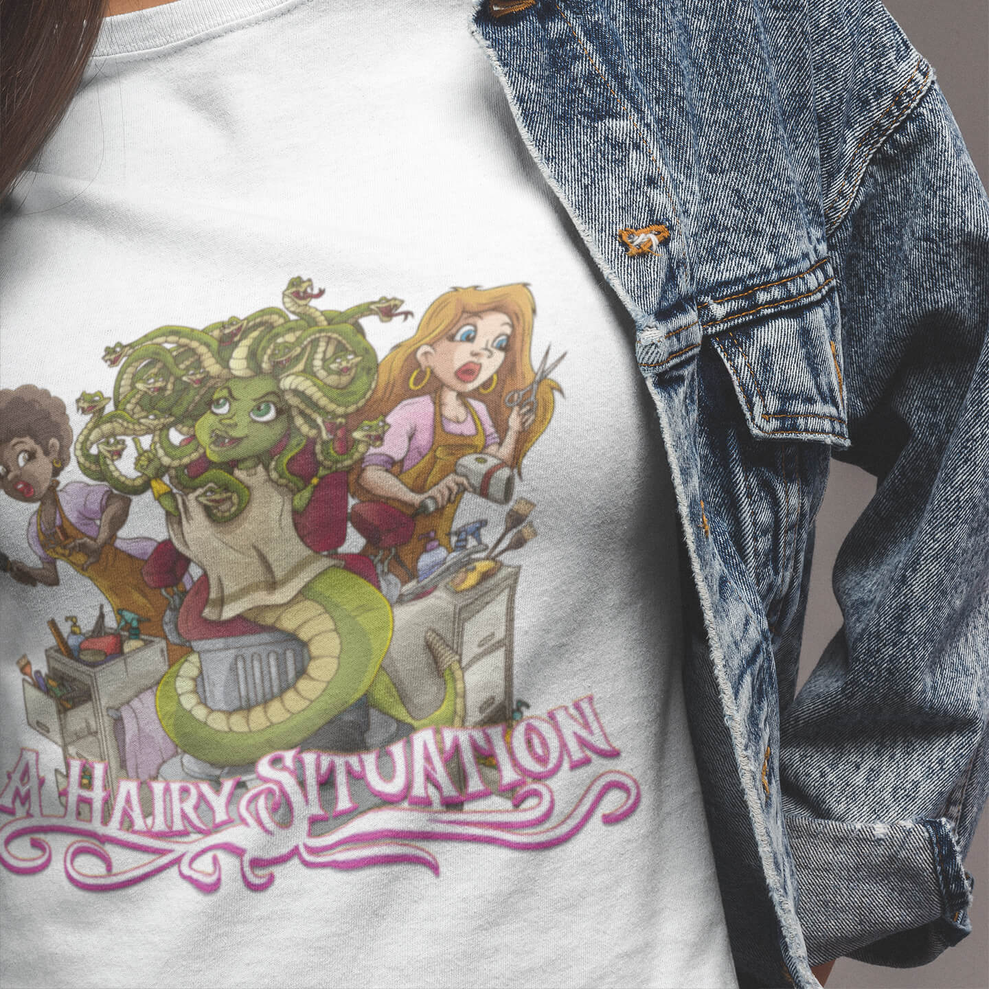 T-shirt with cartoon design and text 'A Hairy Situation' next to a denim jacket.