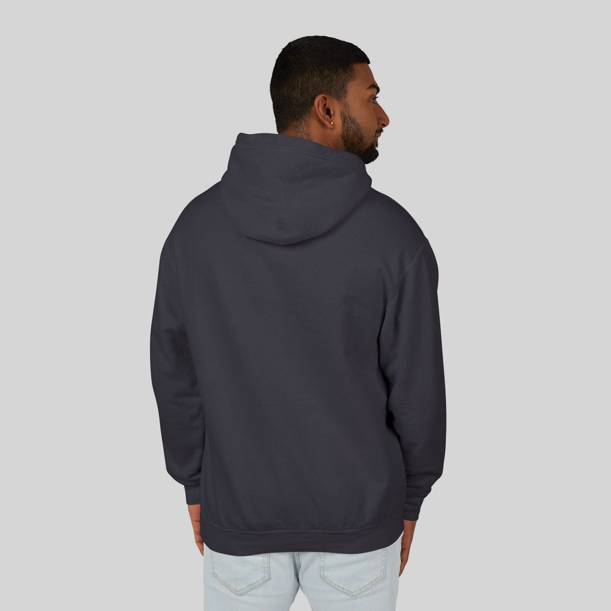 Man wearing a dark gray hoodie on a light gray background