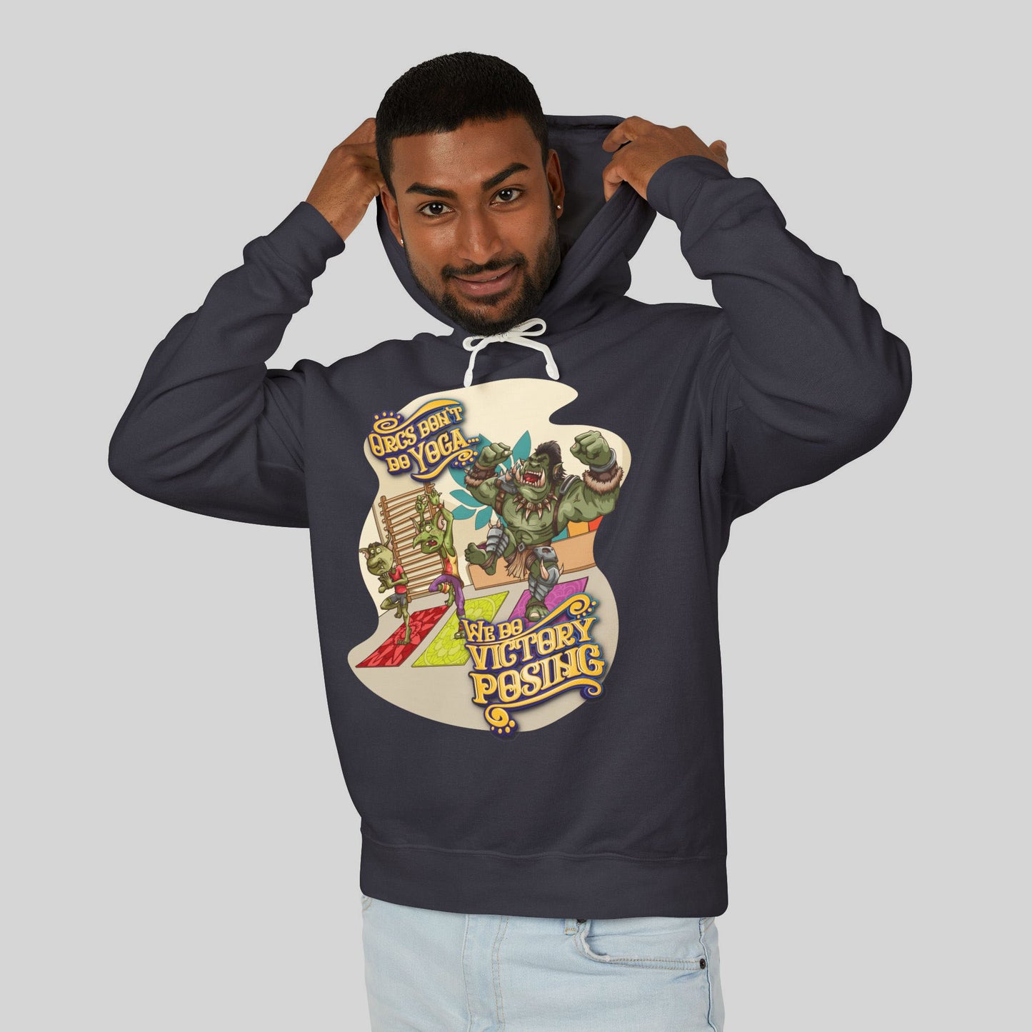 Person wearing a navy blue hoodie with a colorful graphic design on a light gray background