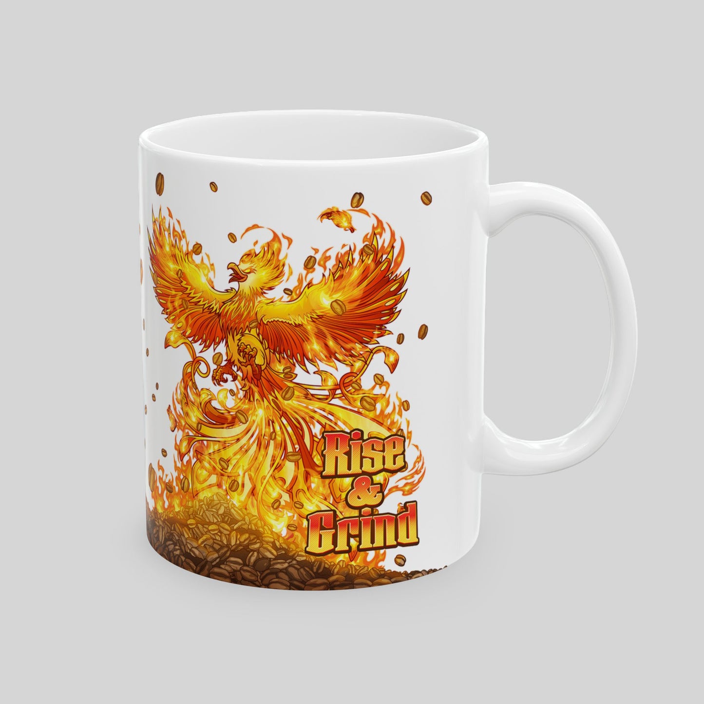 White 11oz ceramic mug with colorful fantasy phoenix rising from coffee beans; text: “Rise & Grind”