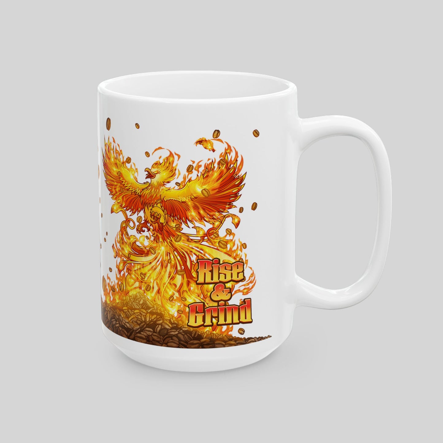 White 15 oz ceramic mug with colorful phoenix rising from coffee beans; text: “Rise & Grind”