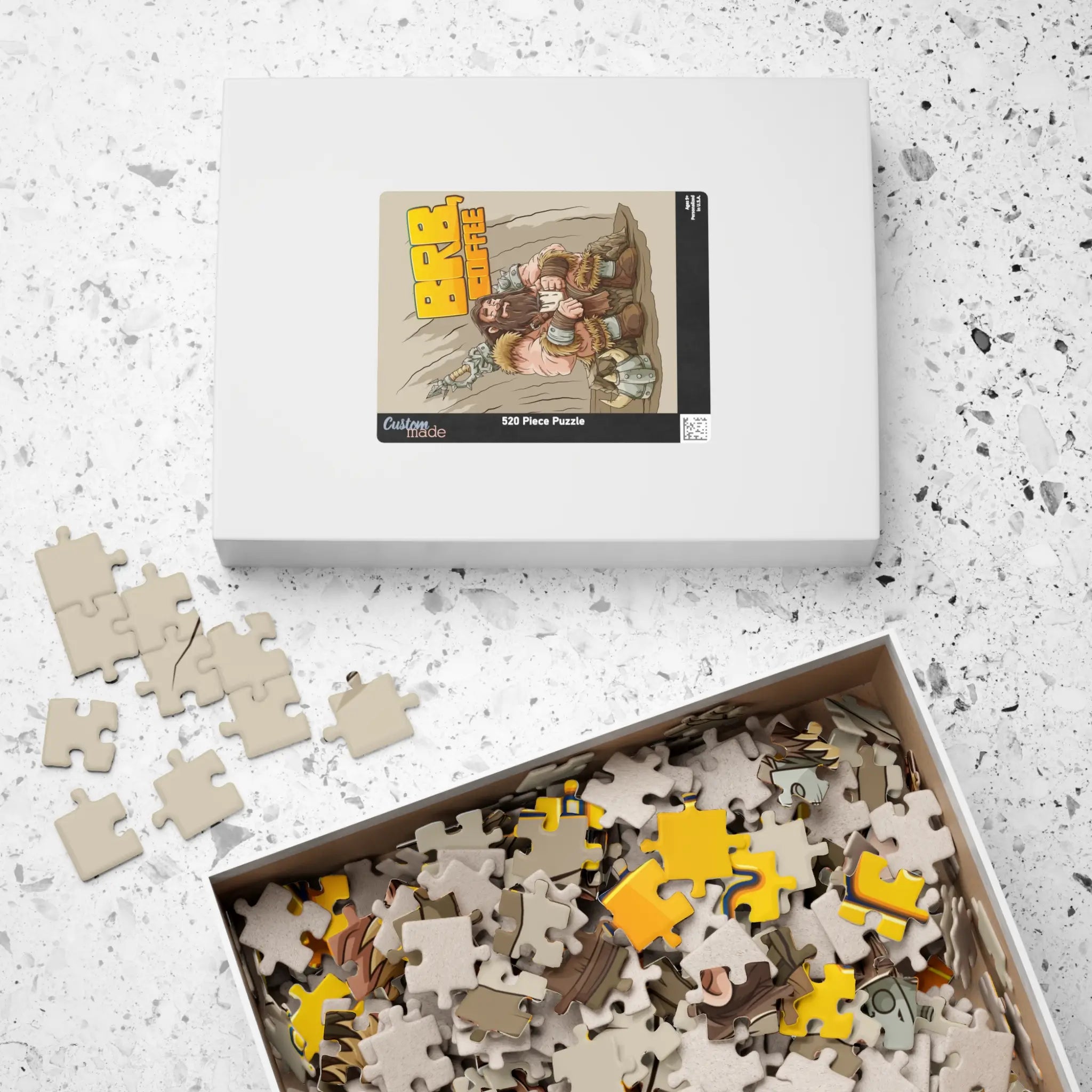 Barbarian’s Coffee Break 520-piece puzzle—lid with reference image of artwork,, tray open, colourful pieces visible in box