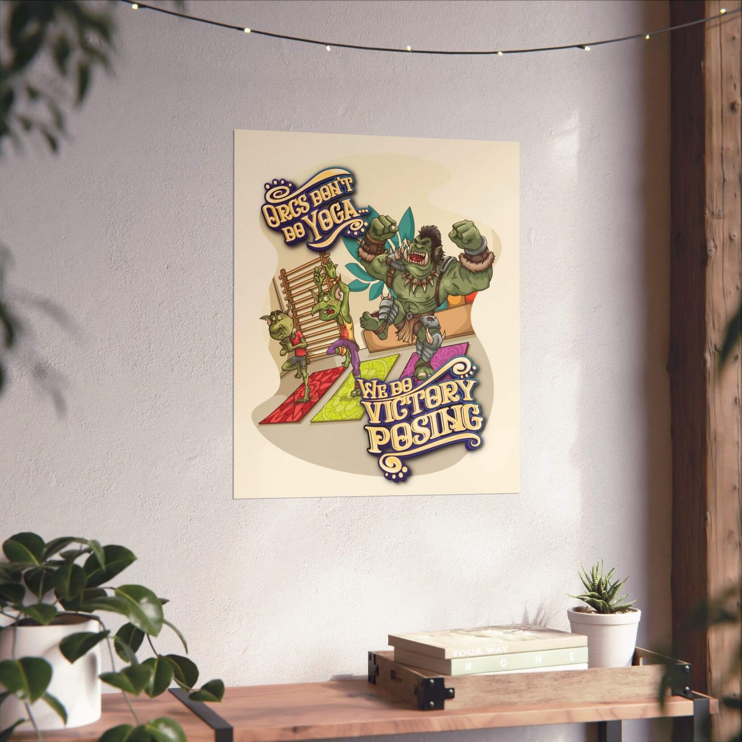 Funny orc gym poster shown on a wall: a flexing orc and yoga goblins, 'Orcs Don't Do Yoga...', 'We Do Victory Posing'.